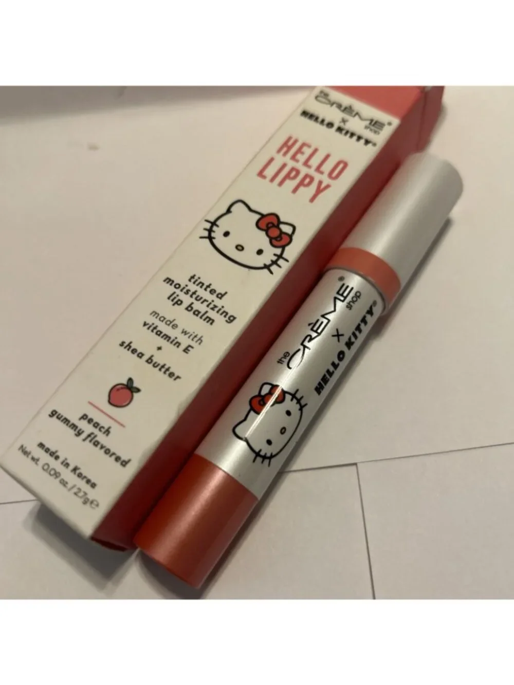 The Crème Shop Hello Kitty & Friends Tinted Peach Moisture Lip Balm Stick .09oz